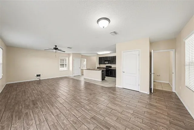 a view of a kitchen with a sink and a stove top oven
