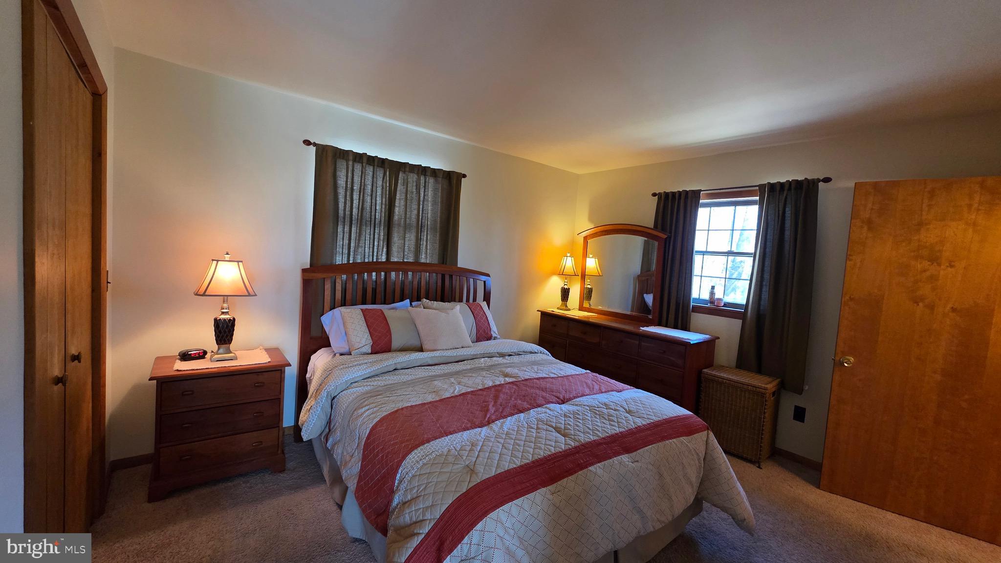 3027 Whitesel Road James Creek, PA 16657 - Photo 11 of 51 a bedroom with a bed and a lamp