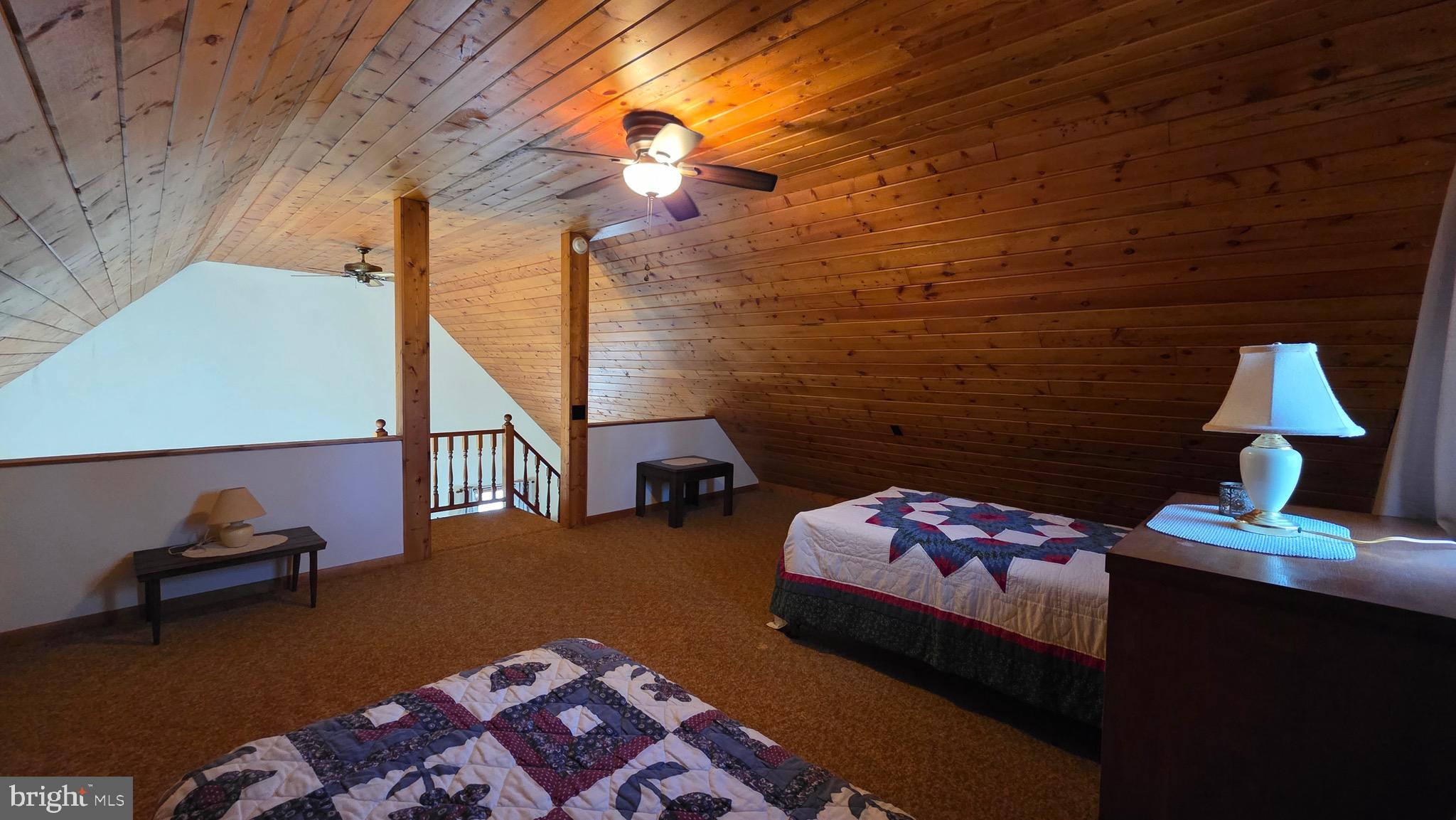 3027 Whitesel Road James Creek, PA 16657 - Photo 15 of 51 a bedroom with furniture and a lamp