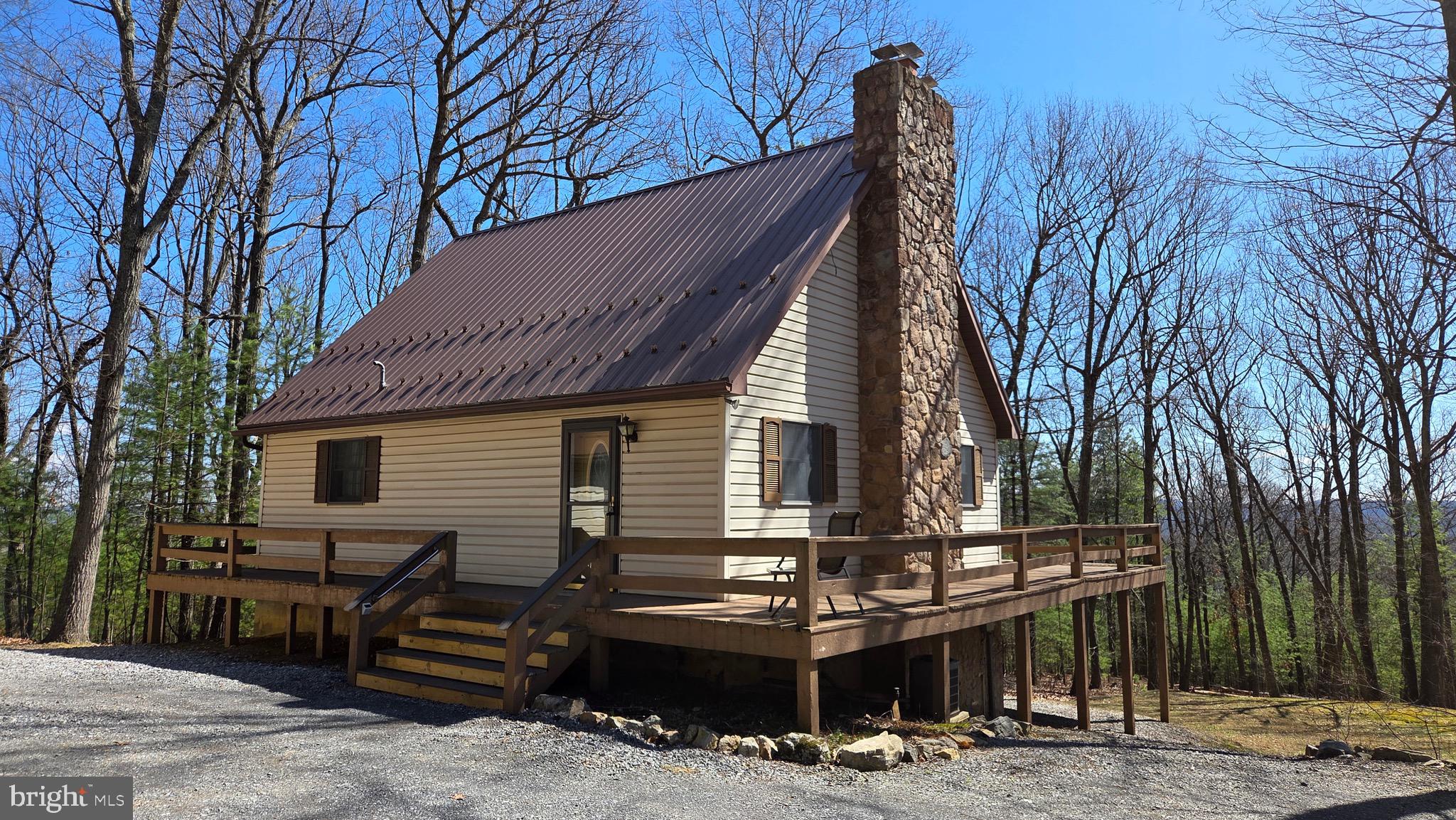 3027 Whitesel Road James Creek, PA 16657 - Photo 27 of 51 a backyard of a house with barbeque oven and outdoor seating