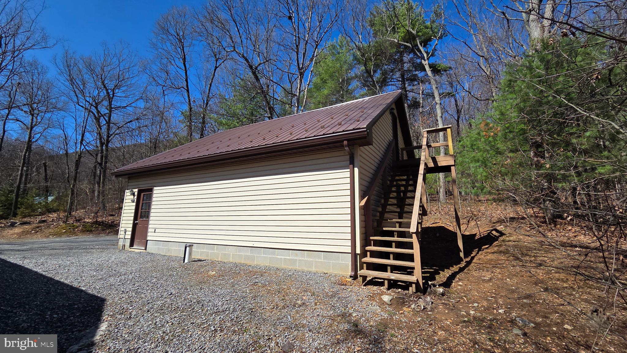 3027 Whitesel Road James Creek, PA 16657 - Photo 35 of 51 a backyard of a house with plants and trees