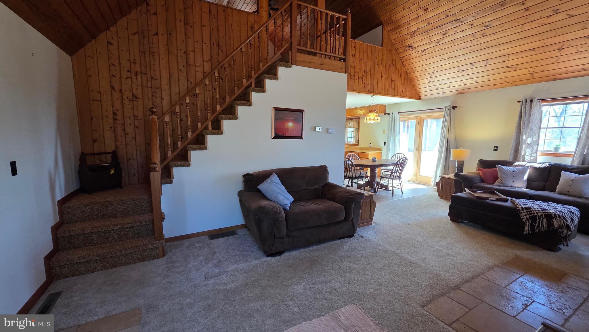 3027 Whitesel Road James Creek, PA 16657 - Photo 5 of 51 a living room with furniture and a chandelier