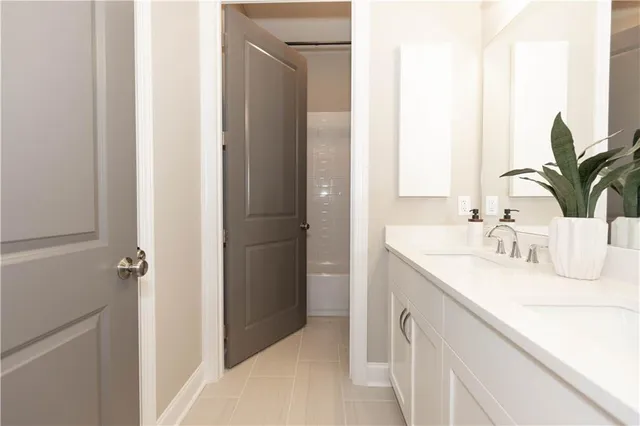 a bed room with a bed and a lamp