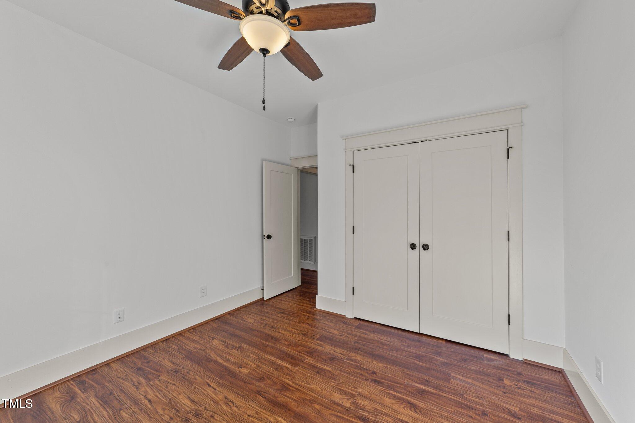 3820 Benson Hardee Road Benson, NC 27504 - Photo 20 of 55 a view of an empty room and wooden floor