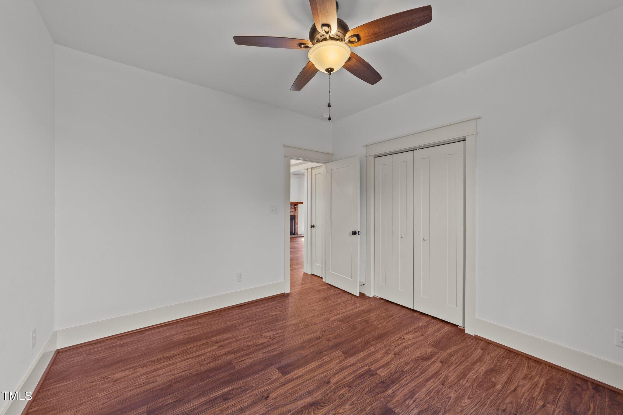 3820 Benson Hardee Road Benson, NC 27504 - Photo 22 of 55 a view of an empty room with wooden floor