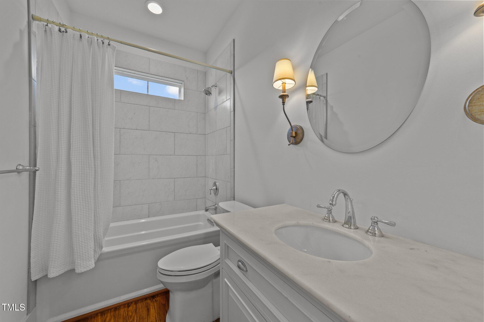 3820 Benson Hardee Road Benson, NC 27504 - Photo 23 of 55 a bathroom with a sink a toilet and shower