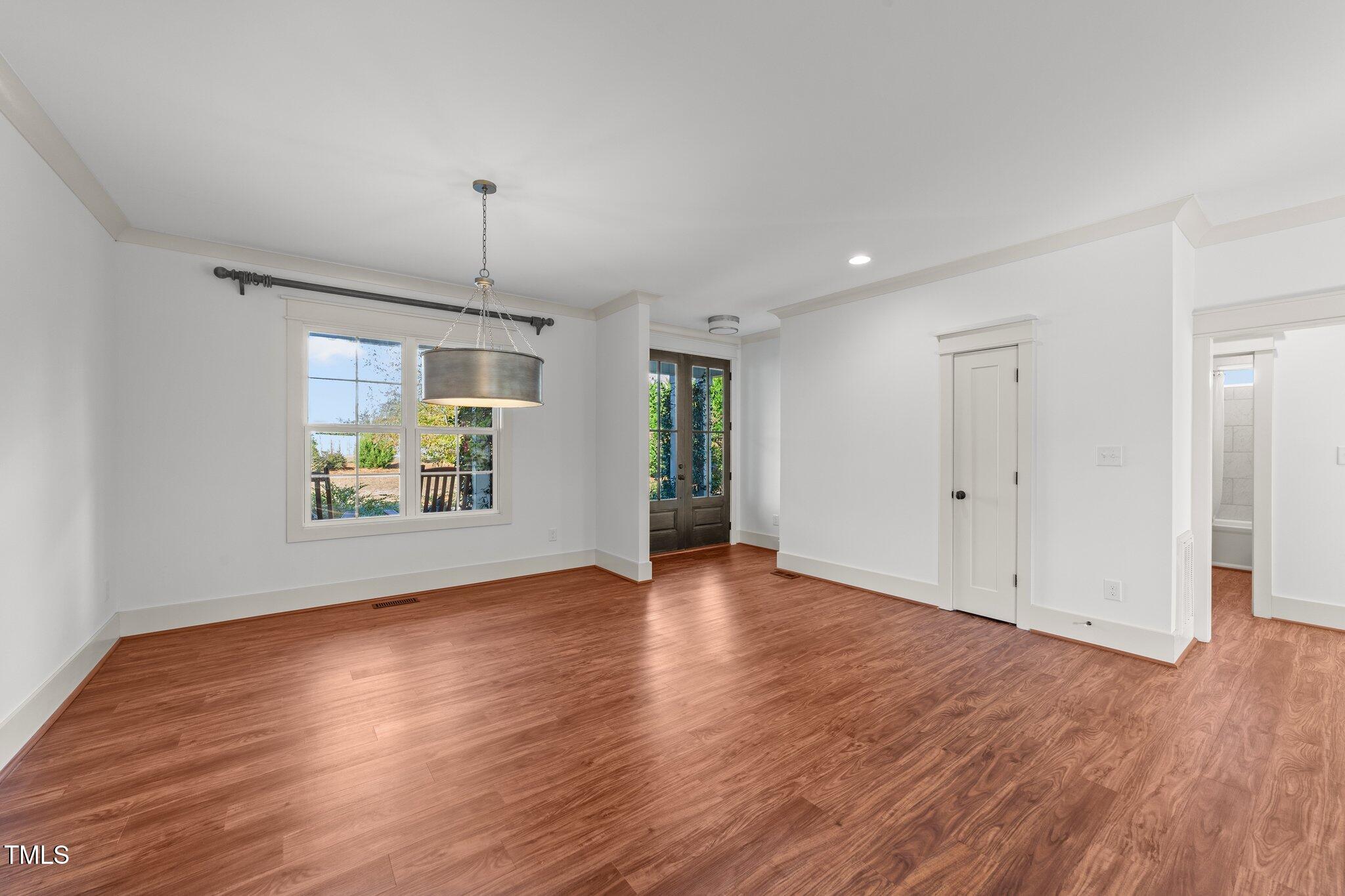 3820 Benson Hardee Road Benson, NC 27504 - Photo 4 of 55 an empty room with wooden floor and window