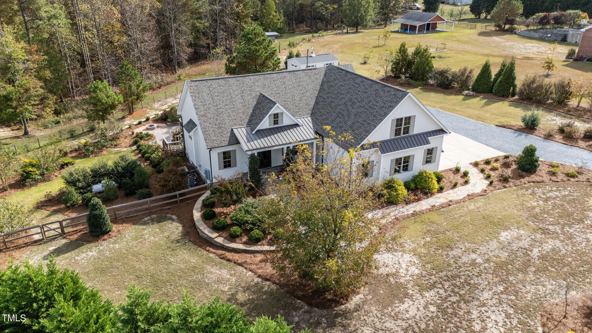 3820 Benson Hardee Road Benson, NC 27504 - Photo 42 of 55 an aerial view of a house with a yard and lake view