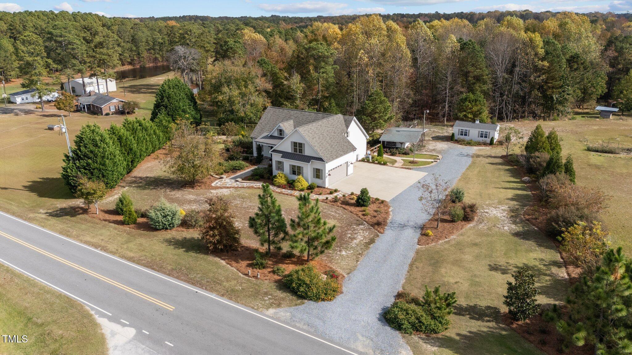 3820 Benson Hardee Road Benson, NC 27504 - Photo 44 of 55 an aerial view of a house with a yard basket ball court and outdoor seating