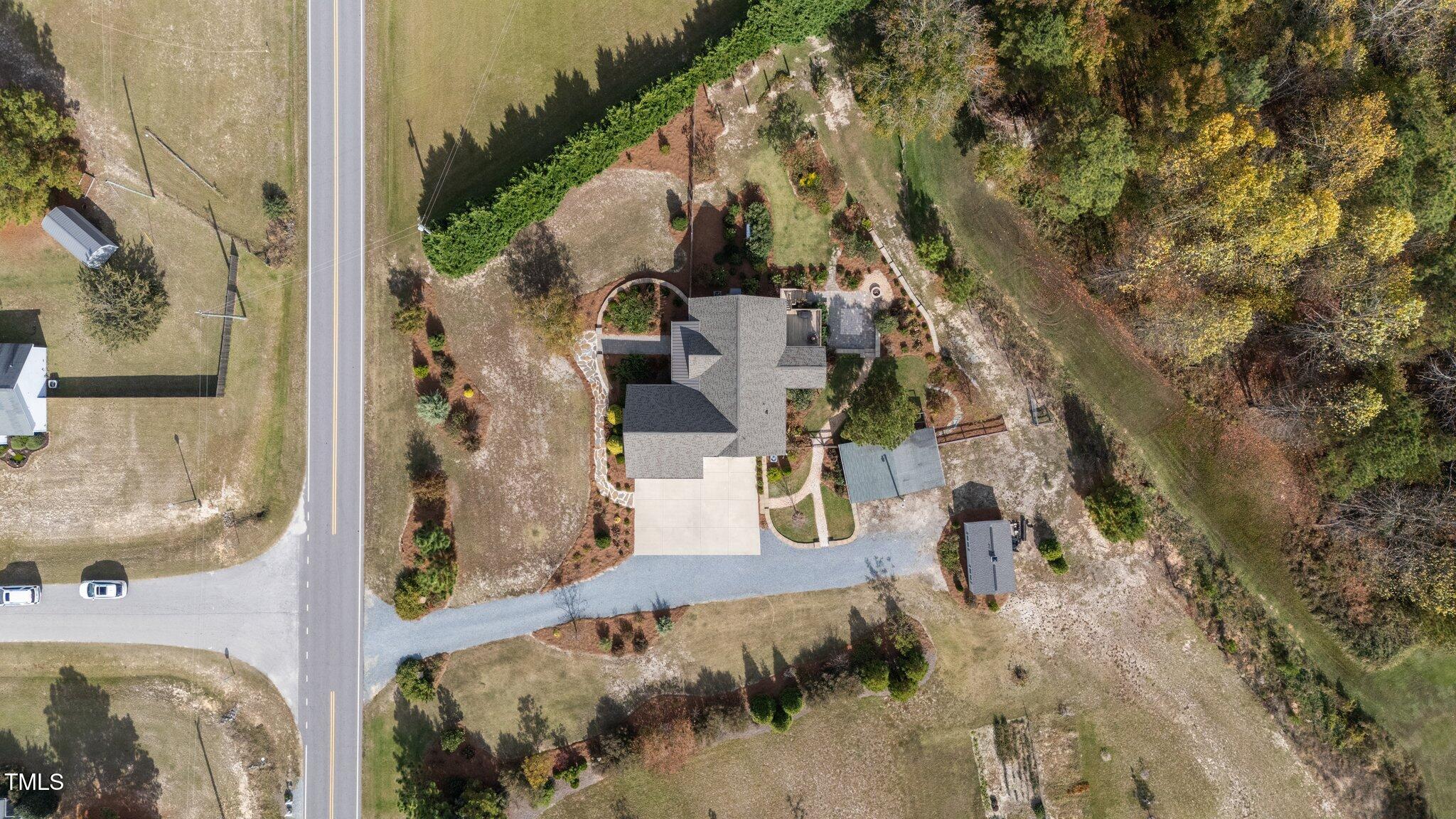 3820 Benson Hardee Road Benson, NC 27504 - Photo 49 of 55 an aerial view of a house with a yard