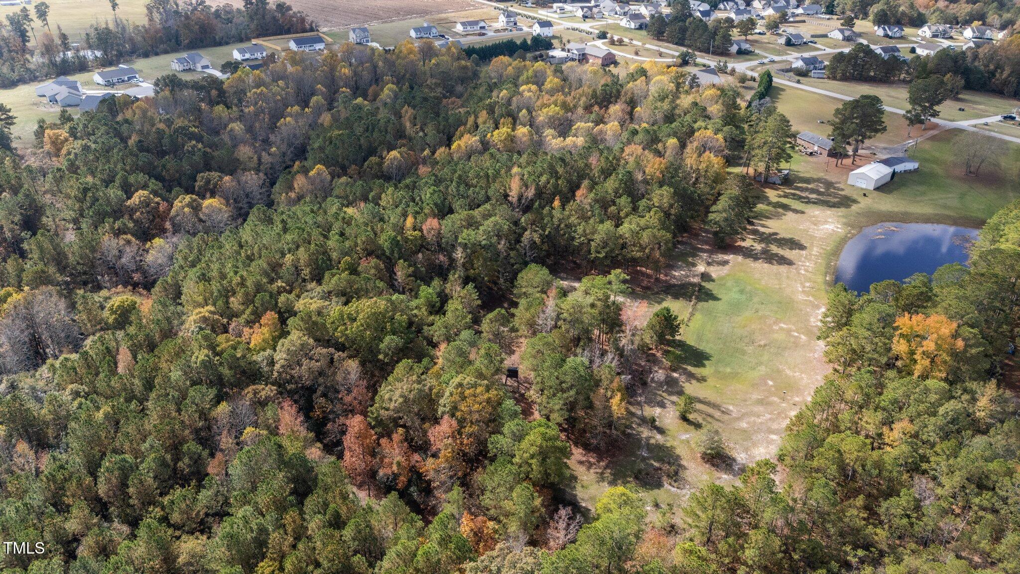 3820 Benson Hardee Road Benson, NC 27504 - Photo 54 of 55 an aerial view of residential houses with outdoor space and trees