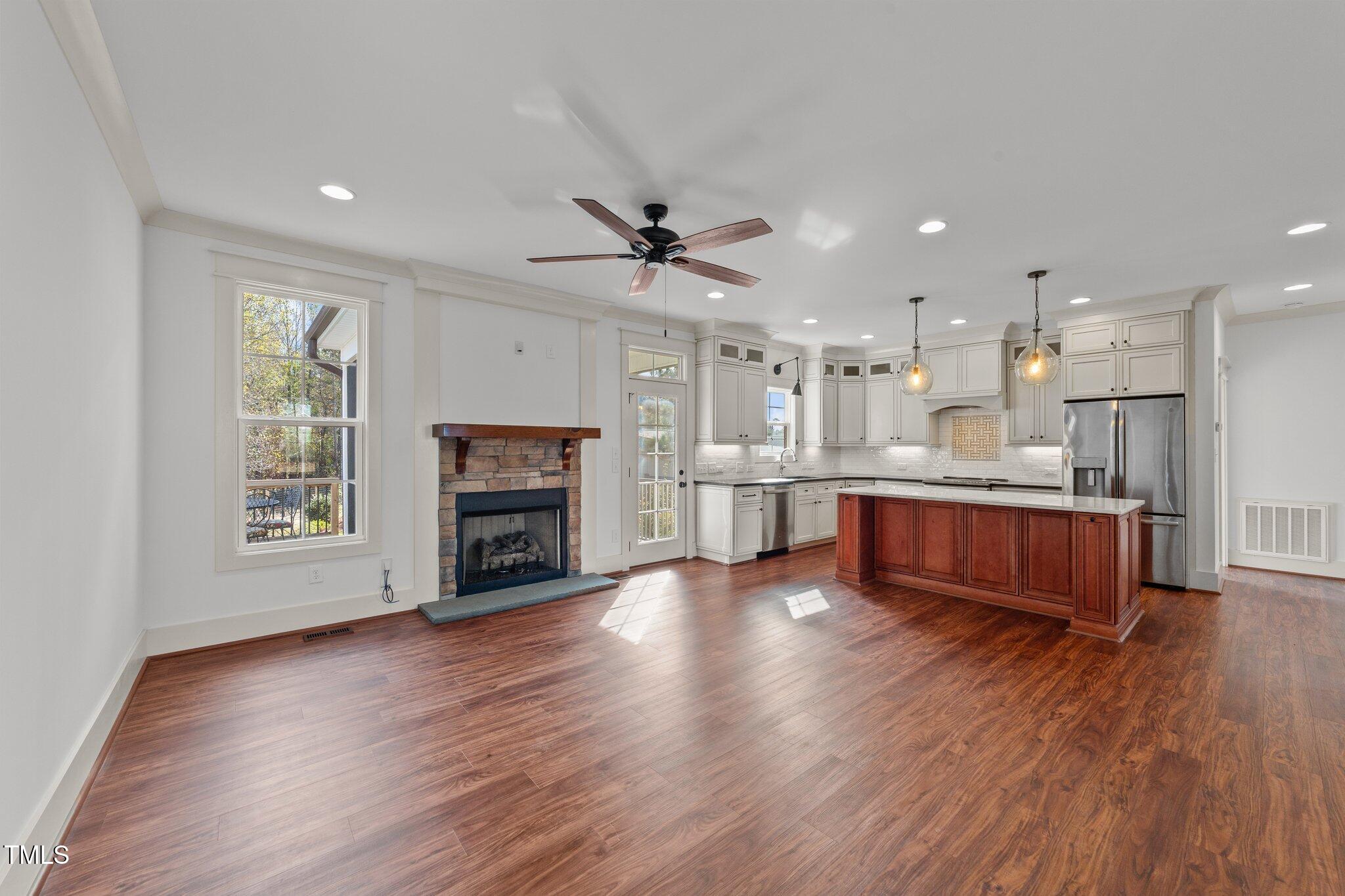 3820 Benson Hardee Road Benson, NC 27504 - Photo 7 of 55 a view of kitchen with furniture wooden floor and a fireplace