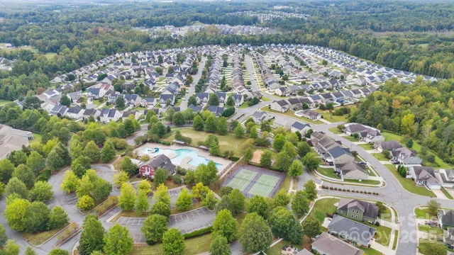an aerial view of residential house with outdoor space and swimming pool
