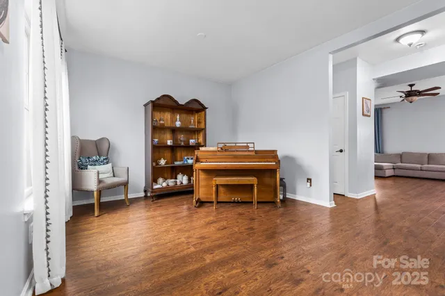 a view of a livingroom with furniture and a bedroom
