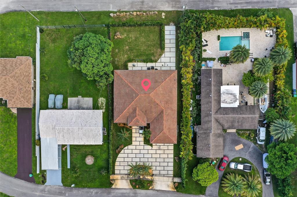 11405 East Golf Drive Miami, FL 33167 - Photo 25 of 25 an aerial view of a house with a garden
