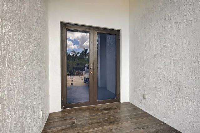 a view of hallway with wooden floor