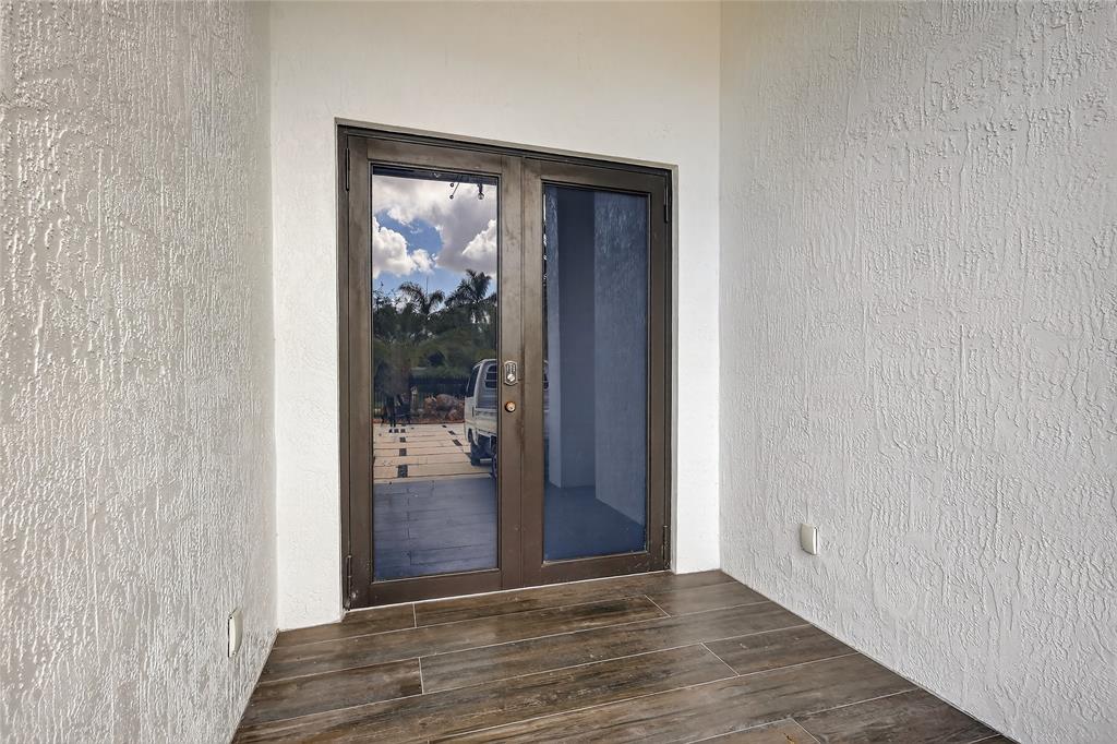 11405 East Golf Drive Miami, FL 33167 - Photo 6 of 25 a view of hallway with wooden floor