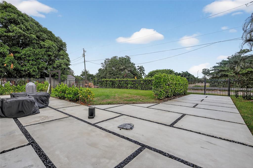 11405 East Golf Drive Miami, FL 33167 - Photo 10 of 25 a view of a street with potted plants