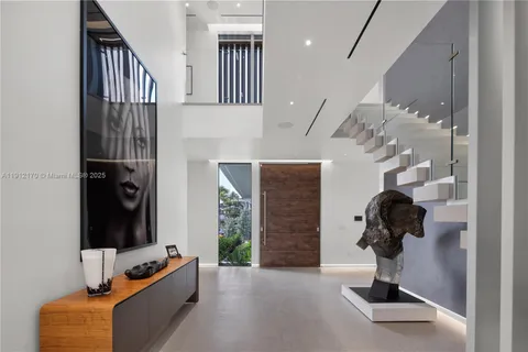 a view of hallway with livingroom and furniture
