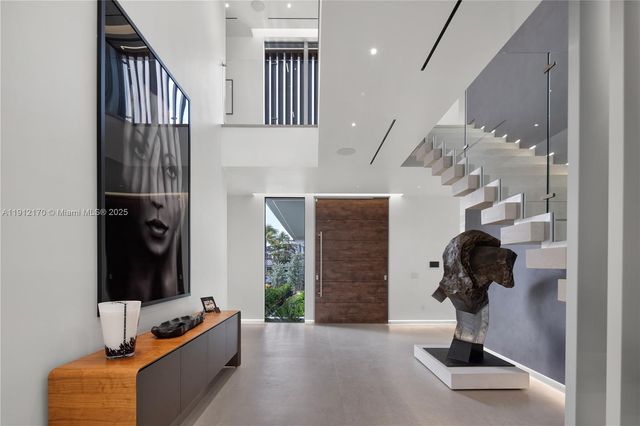 a view of hallway with livingroom and furniture