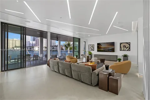 a kitchen with kitchen island granite countertop a sink stove and refrigerator