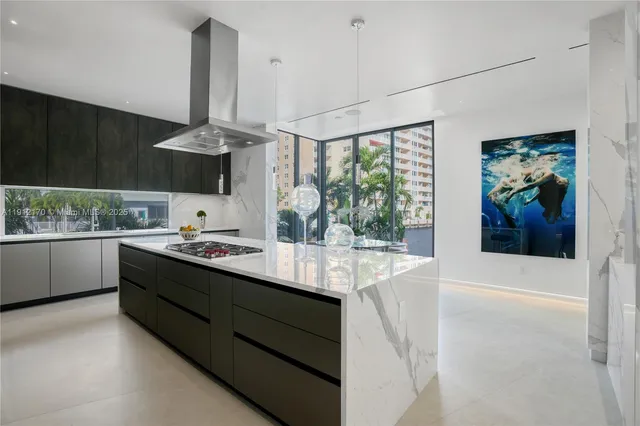 a kitchen with stainless steel appliances a sink and cabinets