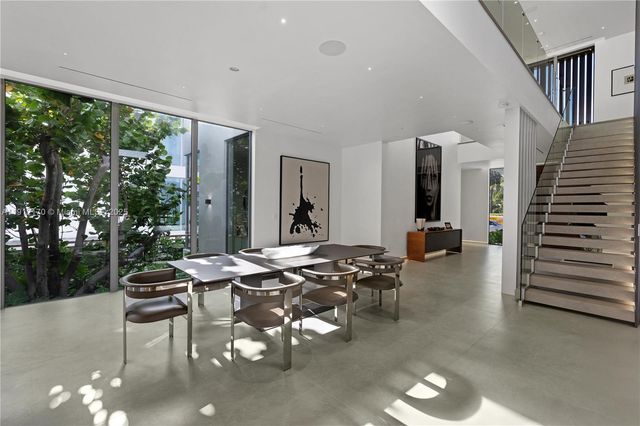 a bathroom with a granite countertop sink a mirror and shower