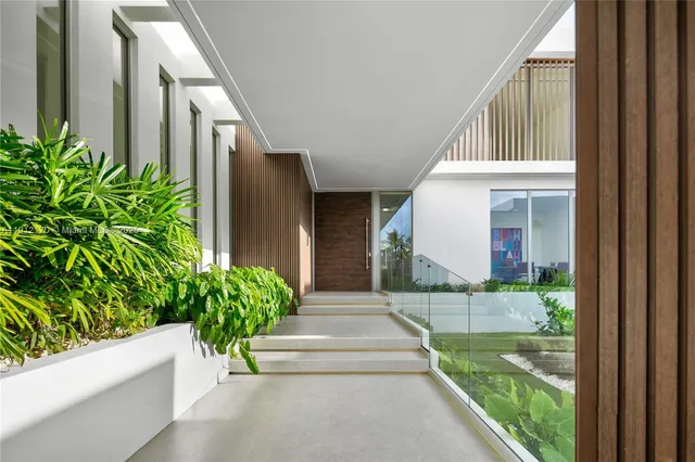 a view of a building with a potted plant and flower plants