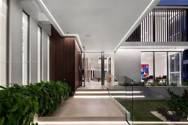 a front view of a house with a garden