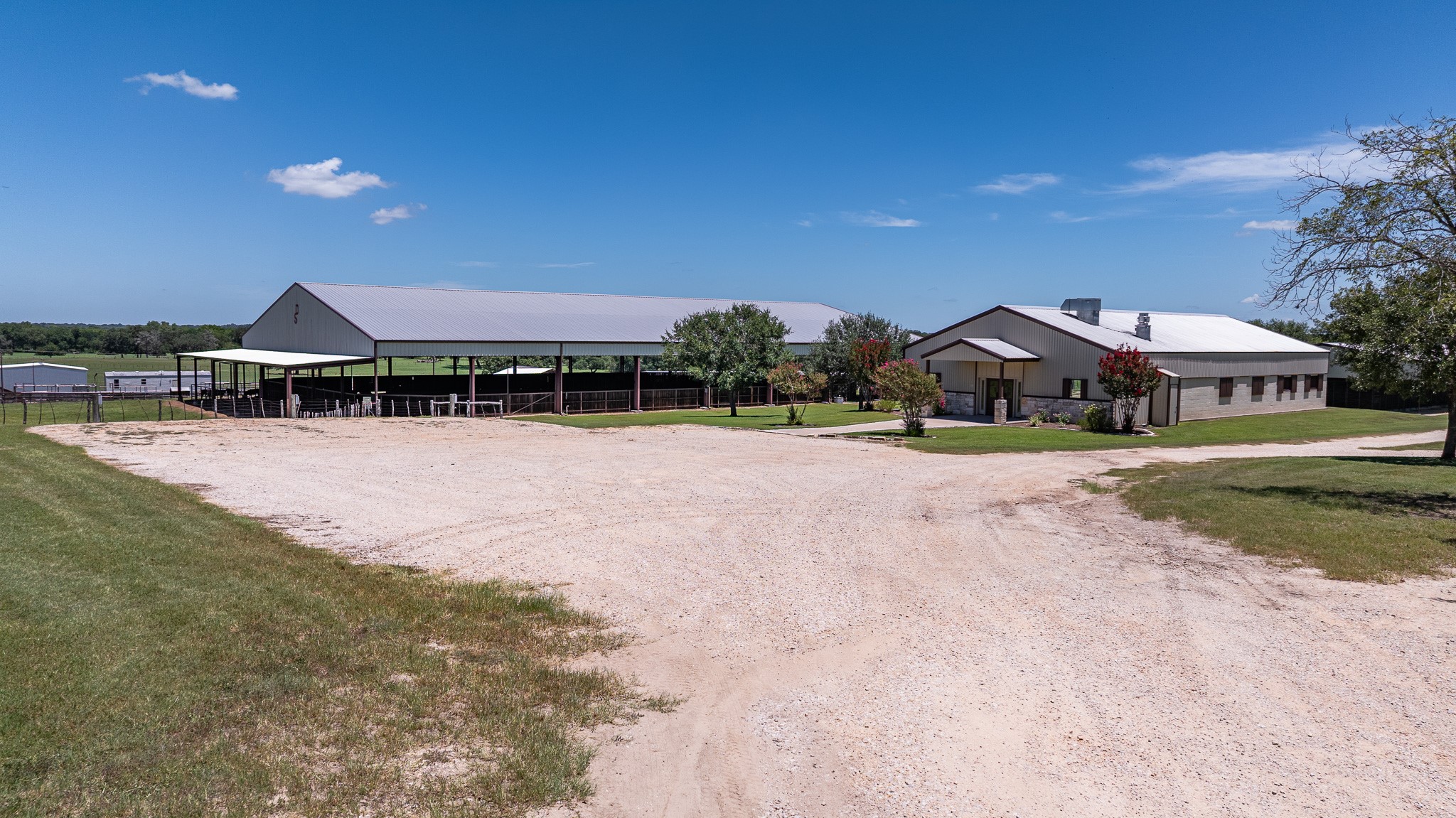 1119 Wolters Road Schulenburg, TX 78956 - Photo 2 of 50 a front view of a house with a yard and lake view