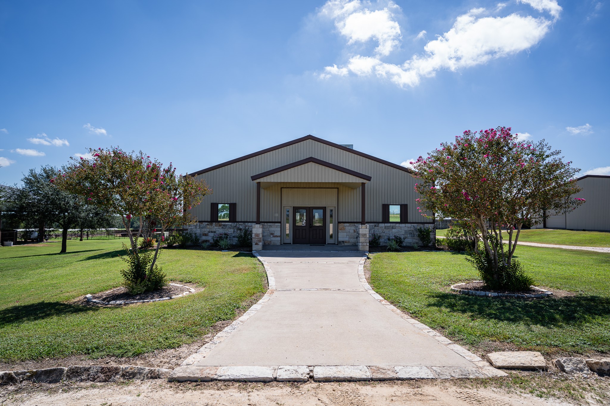 1119 Wolters Road Schulenburg, TX 78956 - Photo 3 of 50 a front view of a house with garden and trees