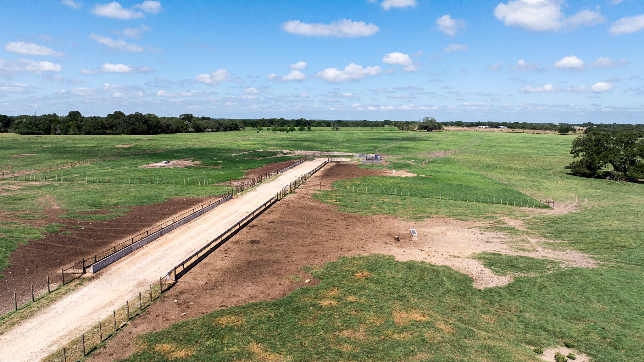 1119 Wolters Road Schulenburg, TX 78956 - Photo 36 of 50 a view of a park with large trees and a wooden fence