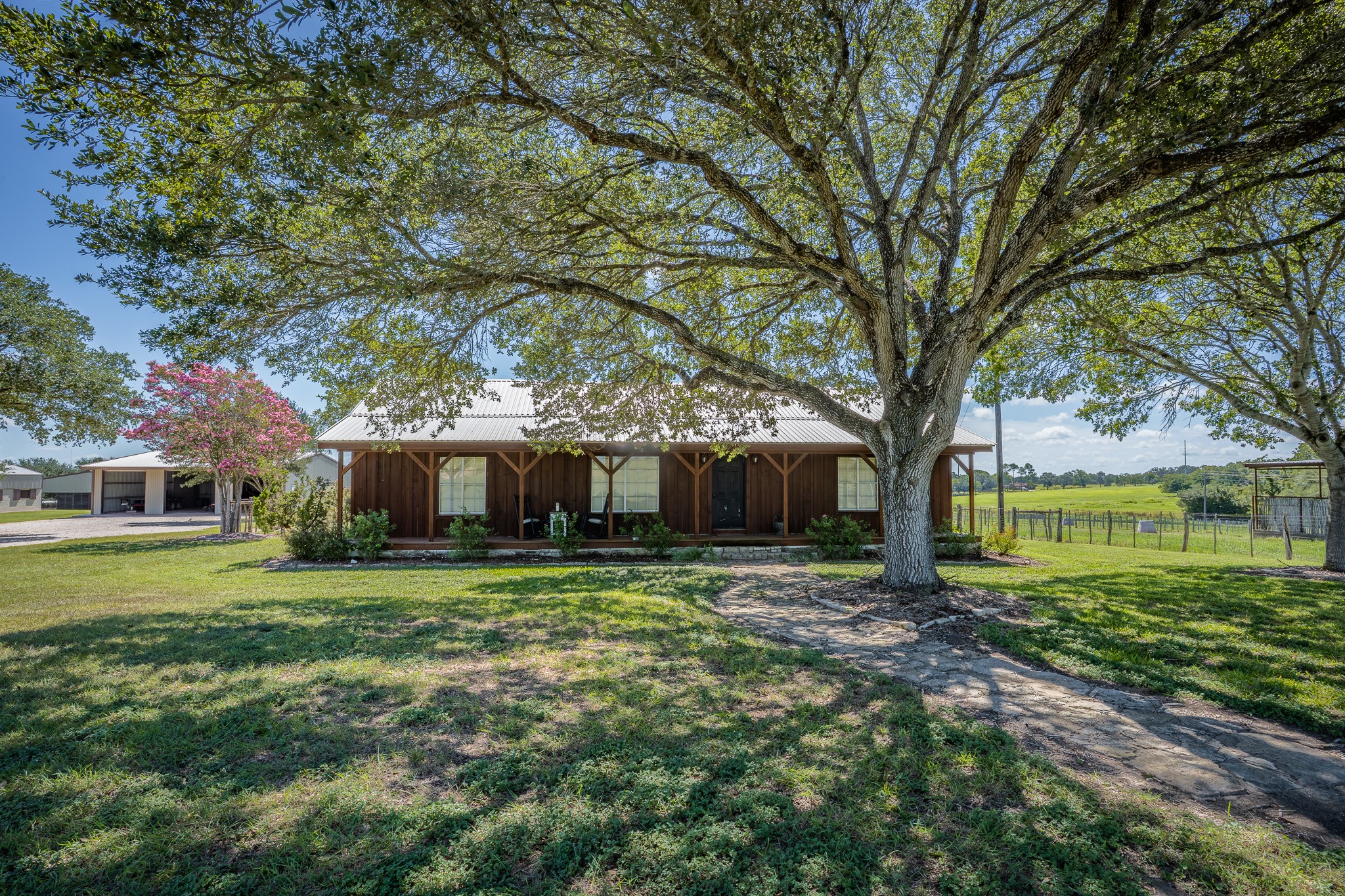1119 Wolters Road Schulenburg, TX 78956 - Photo 40 of 50 a big yard with large trees and a large tree