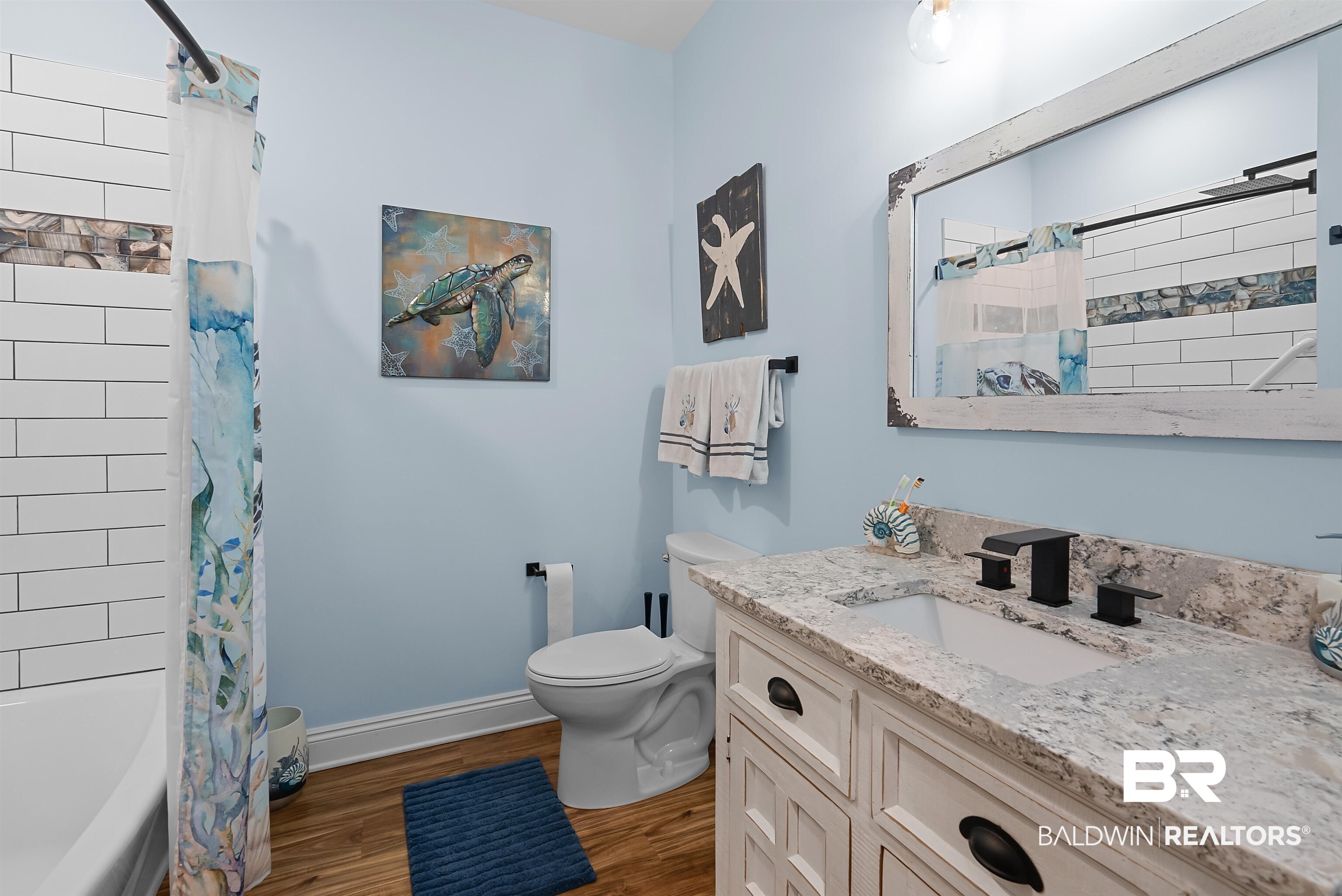 7266 Franklin Road Foley, AL 36535 - Photo 32 of 64 Bathroom featuring a white vanity with dark hardware, a rectangular undermount sink, and a speckled countertop