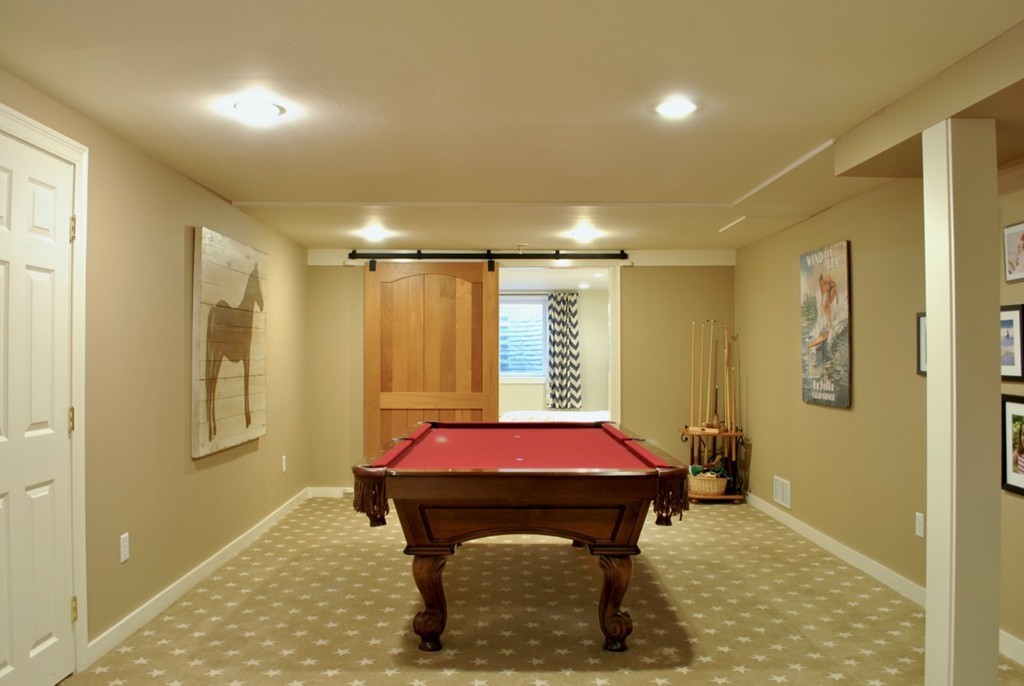17 Giles Road Lincoln, MA 01773 - Photo 14 of 18 a bedroom with a bed and a table in it