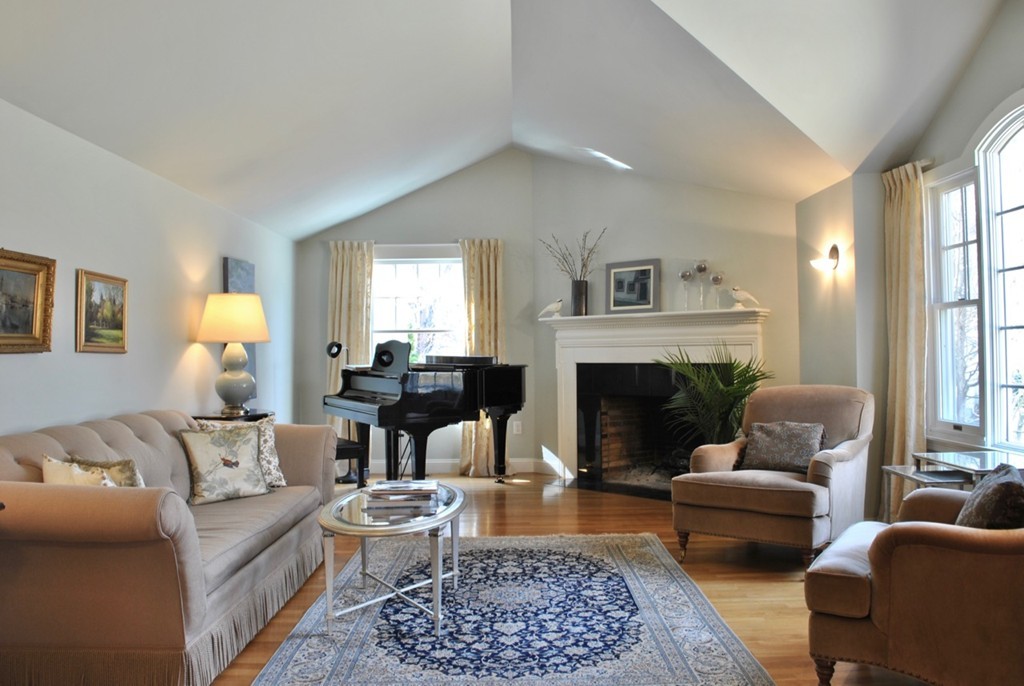 17 Giles Road Lincoln, MA 01773 - Photo 2 of 18 a living room with furniture and a fireplace