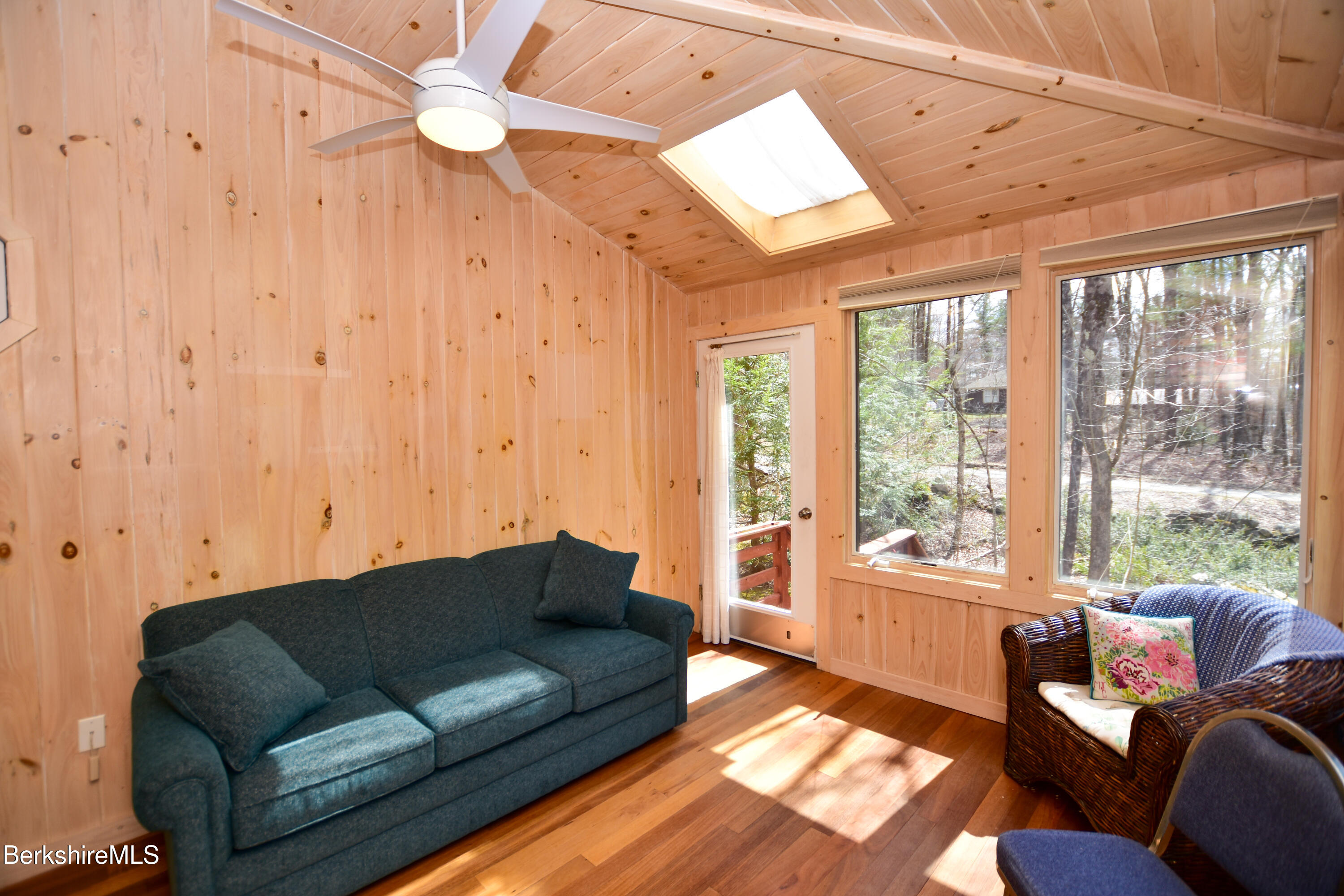 283 Benton Hill Road Becket, MA 01223 - Photo 13 of 55 a living room with furniture and a large window