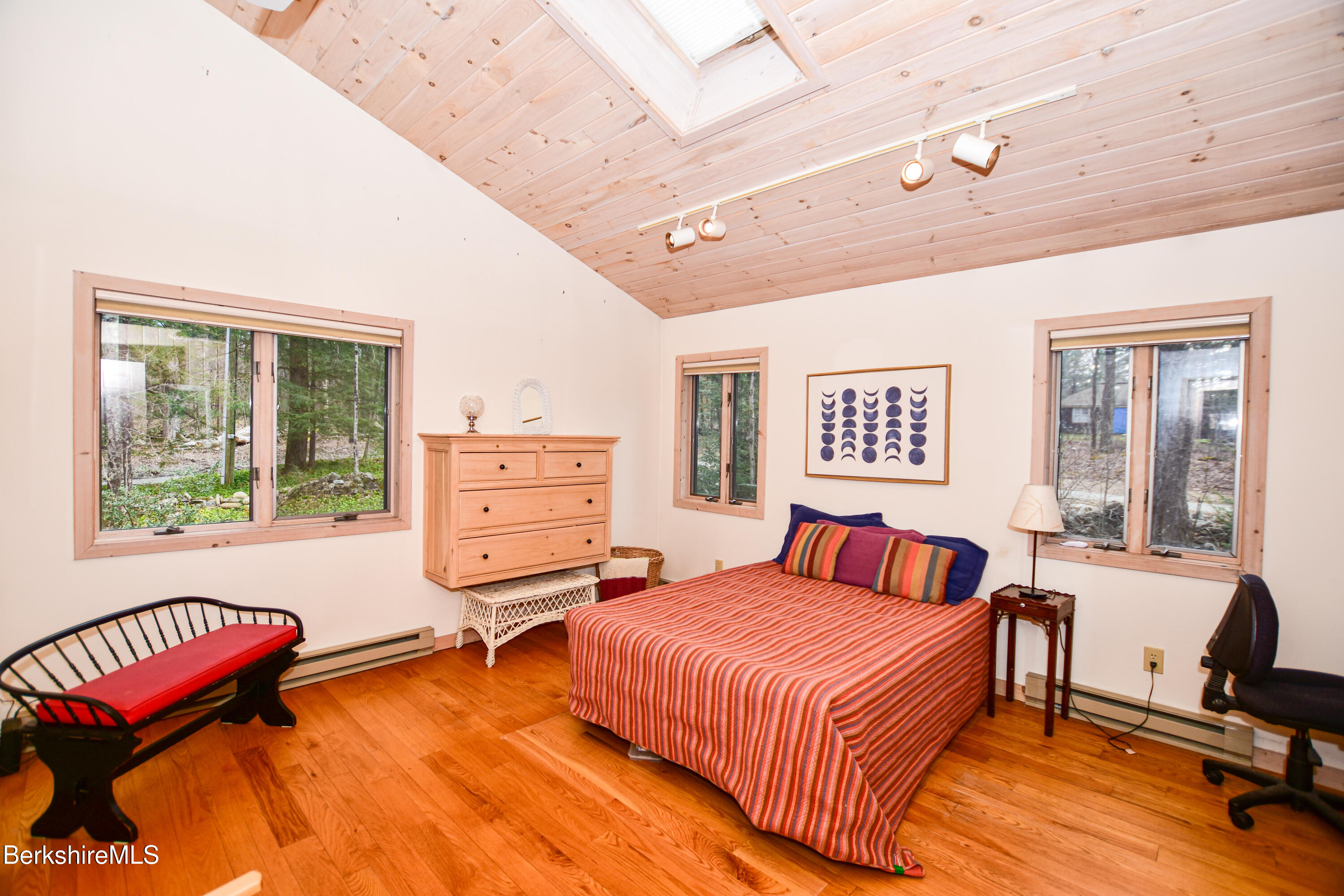 283 Benton Hill Road Becket, MA 01223 - Photo 14 of 55 a bedroom with a bed and wooden floor