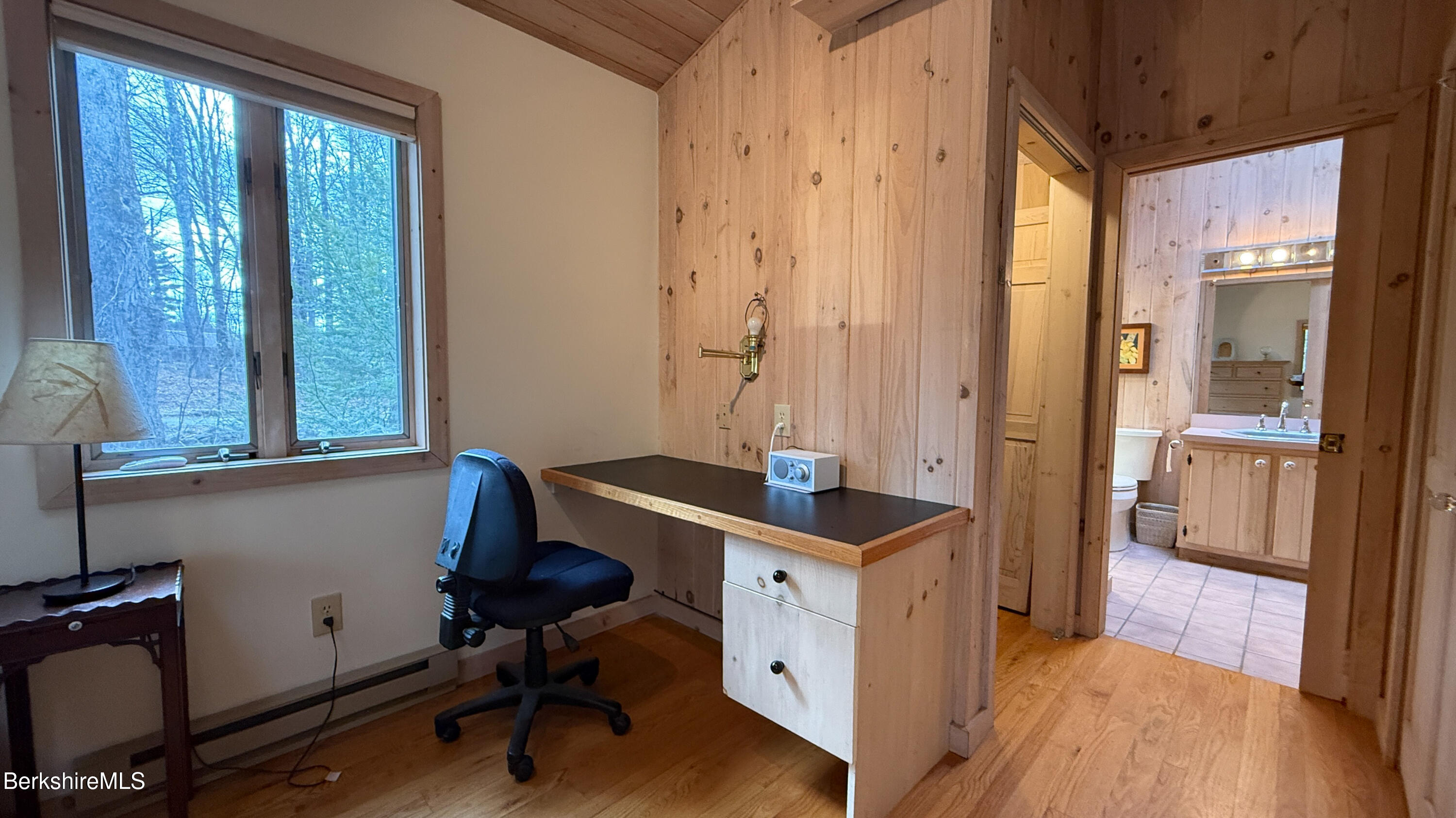 283 Benton Hill Road Becket, MA 01223 - Photo 19 of 55 a view of a hallway with workspace and windows