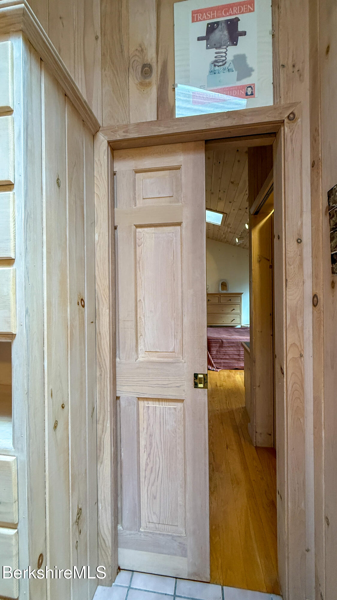 283 Benton Hill Road Becket, MA 01223 - Photo 22 of 55 a view of a hallway with wooden shelves