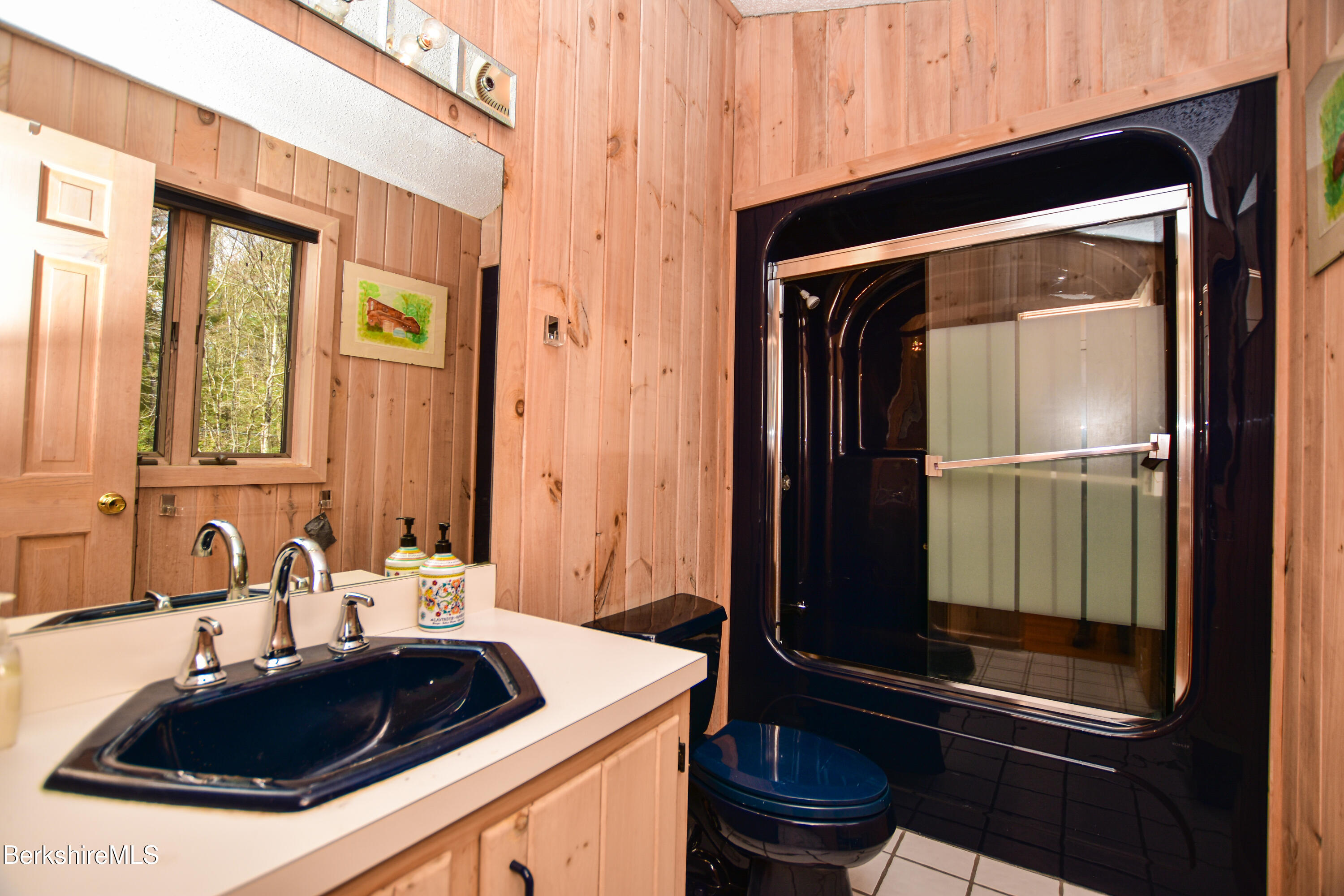 283 Benton Hill Road Becket, MA 01223 - Photo 31 of 55 a bathroom with a sink a toilet and a shower
