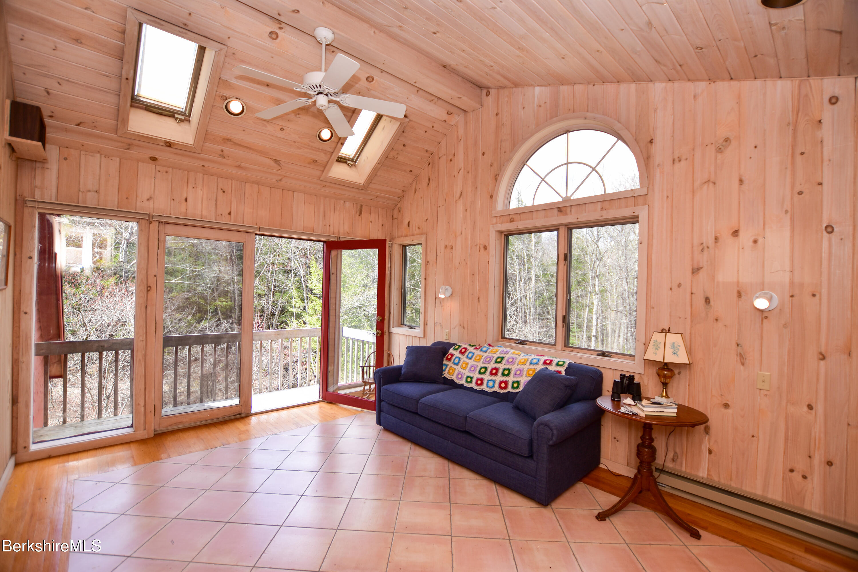 283 Benton Hill Road Becket, MA 01223 - Photo 32 of 55 a living room with furniture and a large window