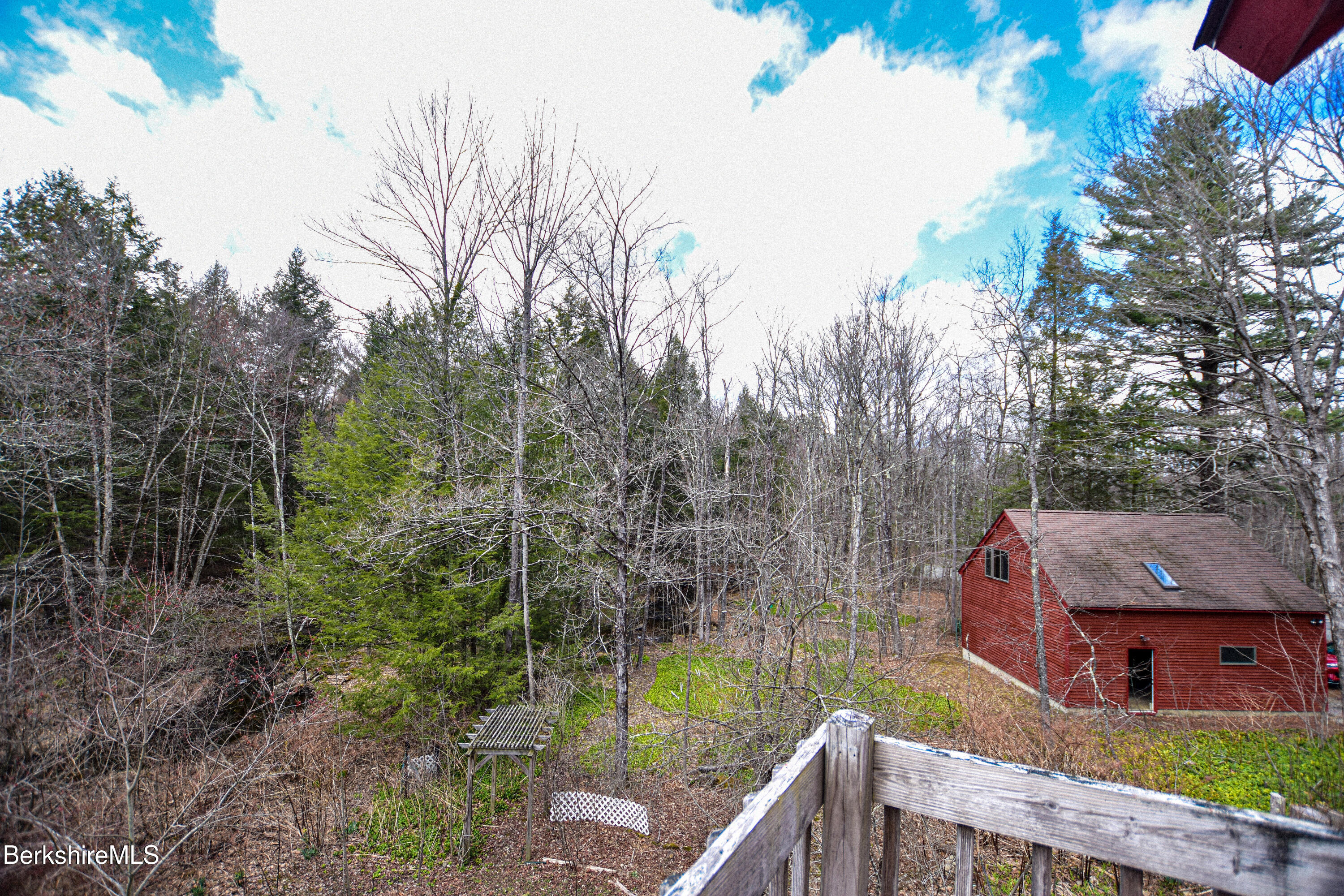 283 Benton Hill Road Becket, MA 01223 - Photo 33 of 55 a front view of a house with garden