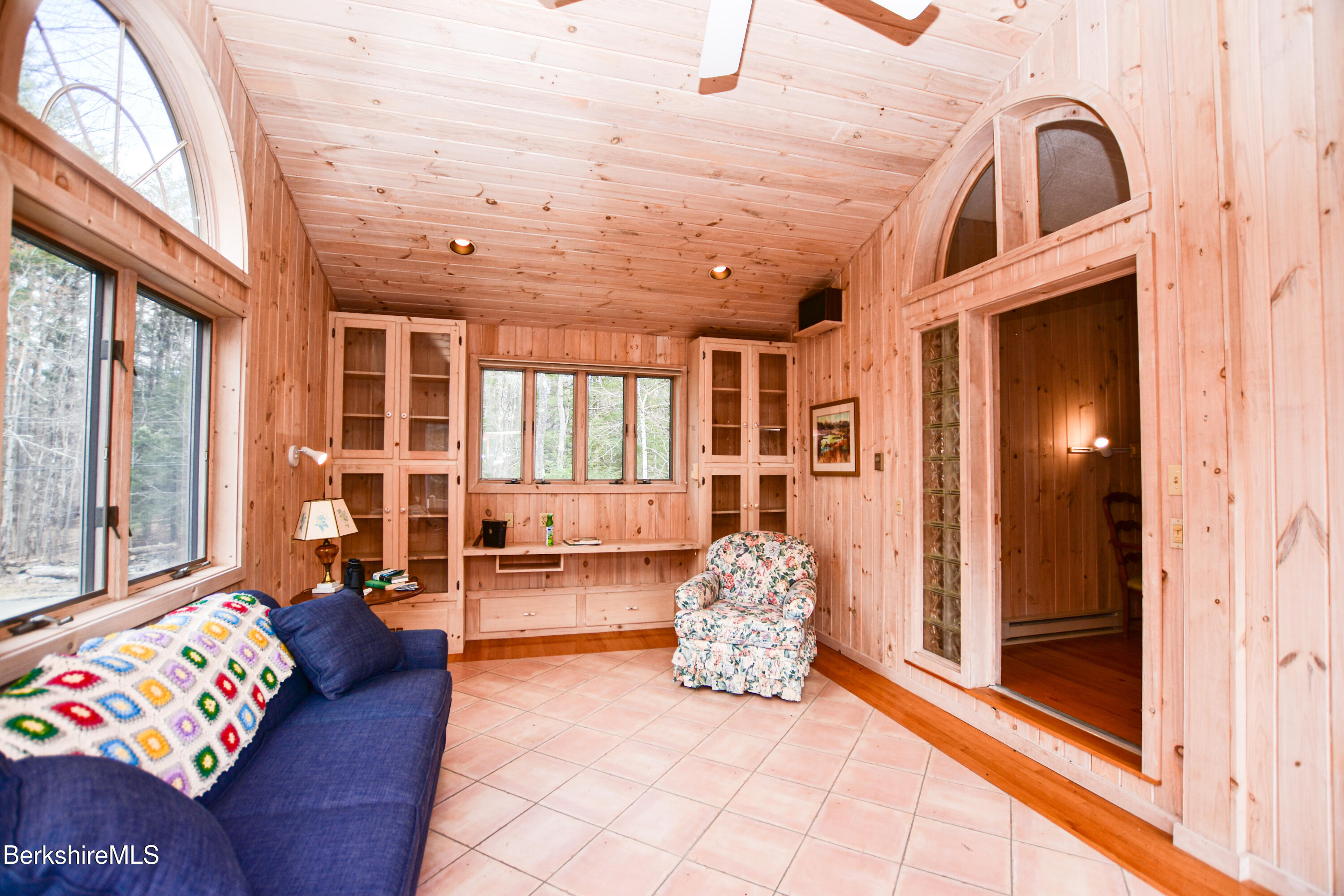 283 Benton Hill Road Becket, MA 01223 - Photo 34 of 55 a living room with furniture and large windows