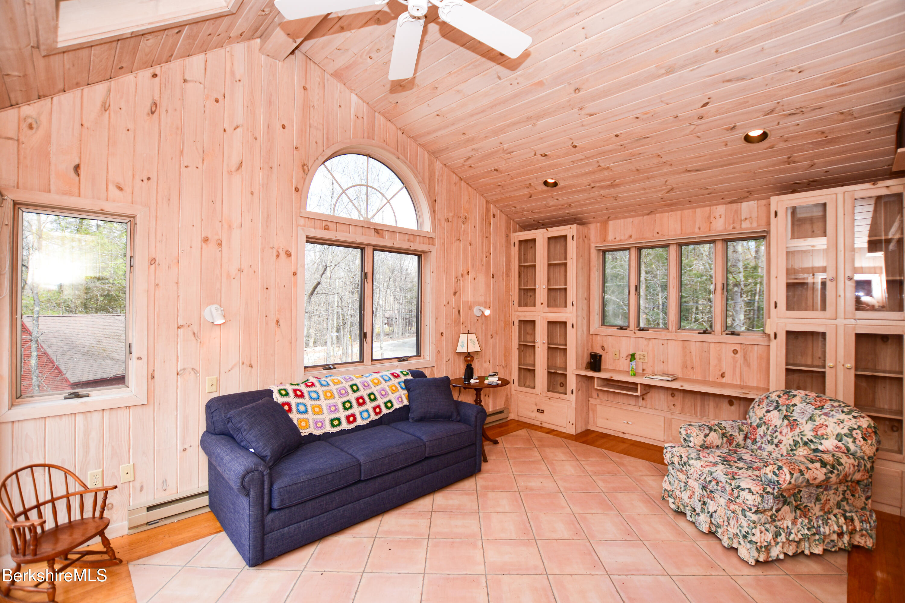 283 Benton Hill Road Becket, MA 01223 - Photo 35 of 55 a living room with furniture and large windows