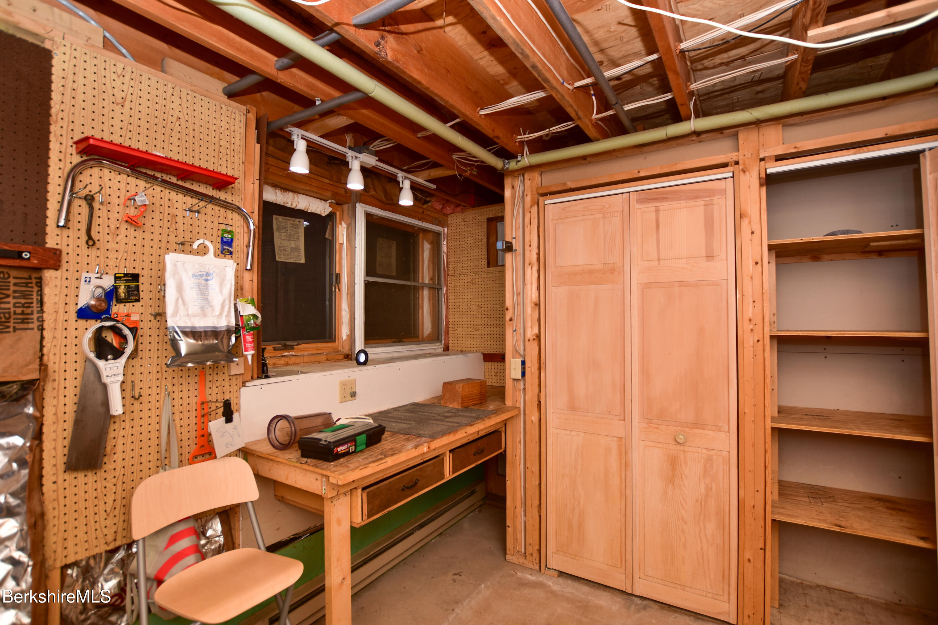 283 Benton Hill Road Becket, MA 01223 - Photo 42 of 55 a room with table and chairs
