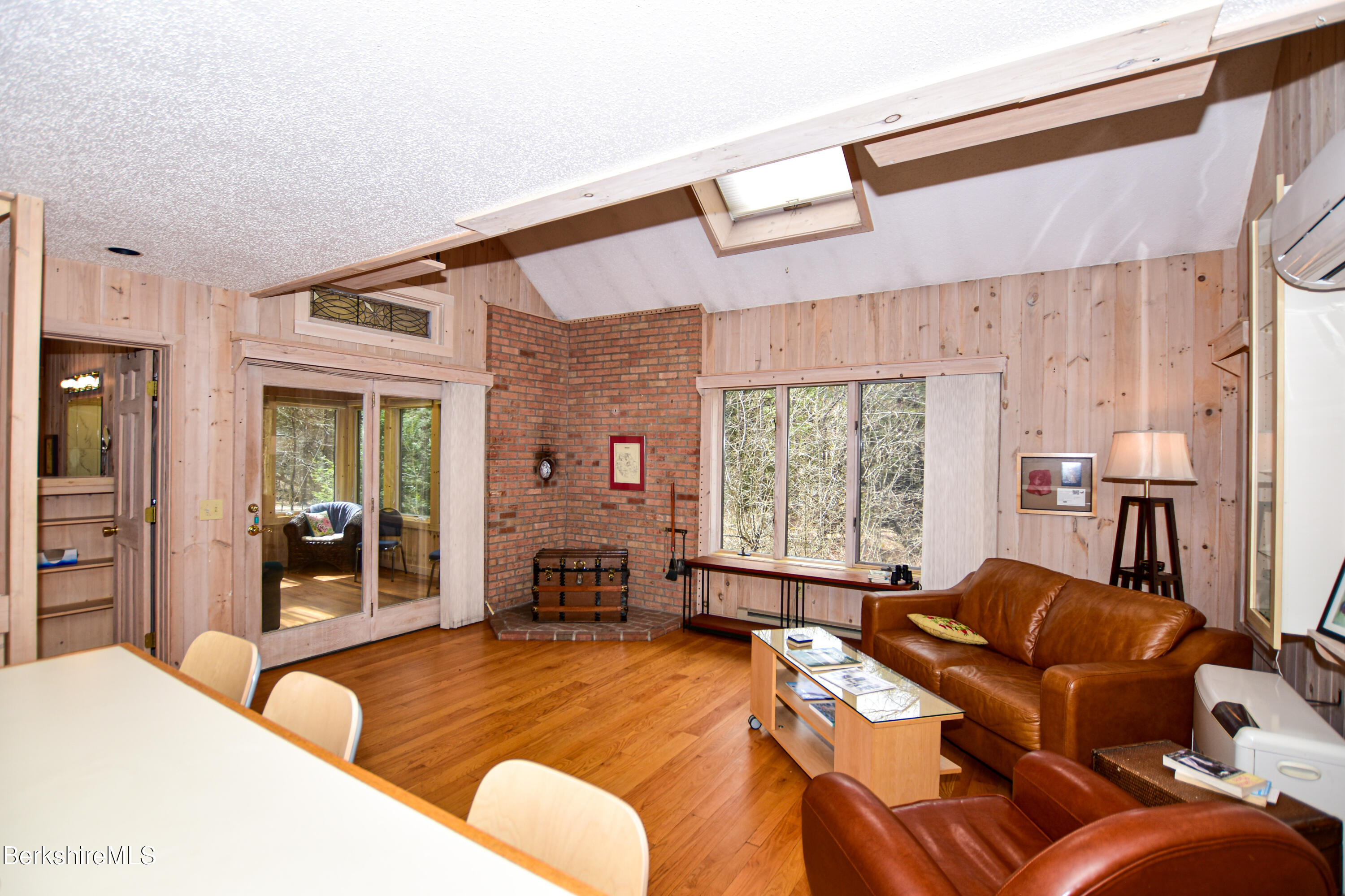 283 Benton Hill Road Becket, MA 01223 - Photo 5 of 55 a large bedroom with a bed and glass windows