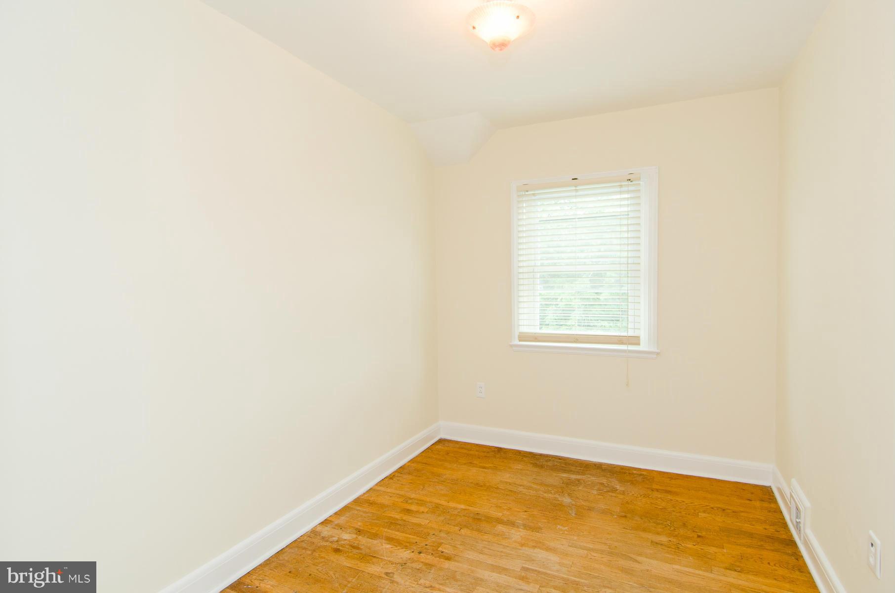 1417 Stonewood Road Baltimore, MD 21239 - Photo 17 of 28 a view of a big room with windows