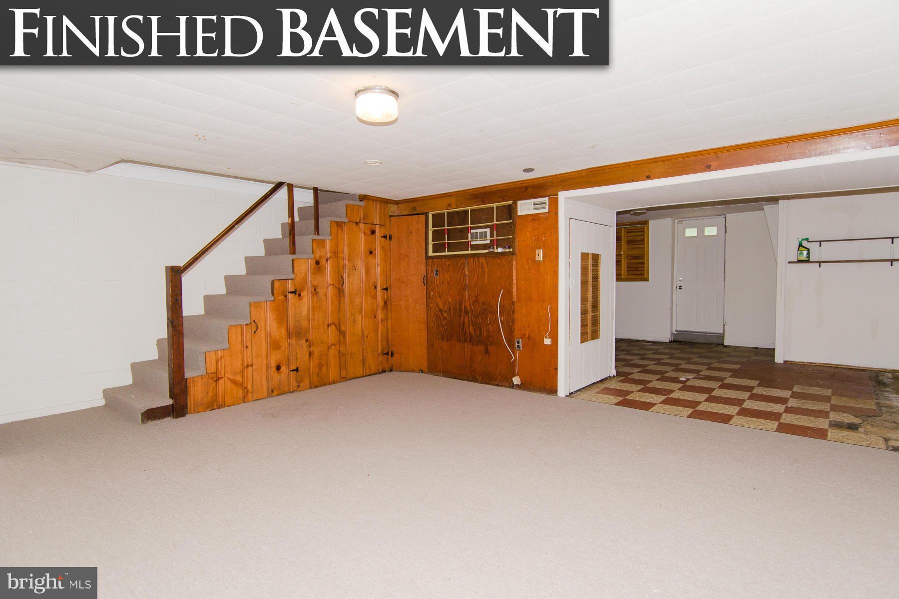 1417 Stonewood Road Baltimore, MD 21239 - Photo 19 of 28 a view of a room with wooden walls