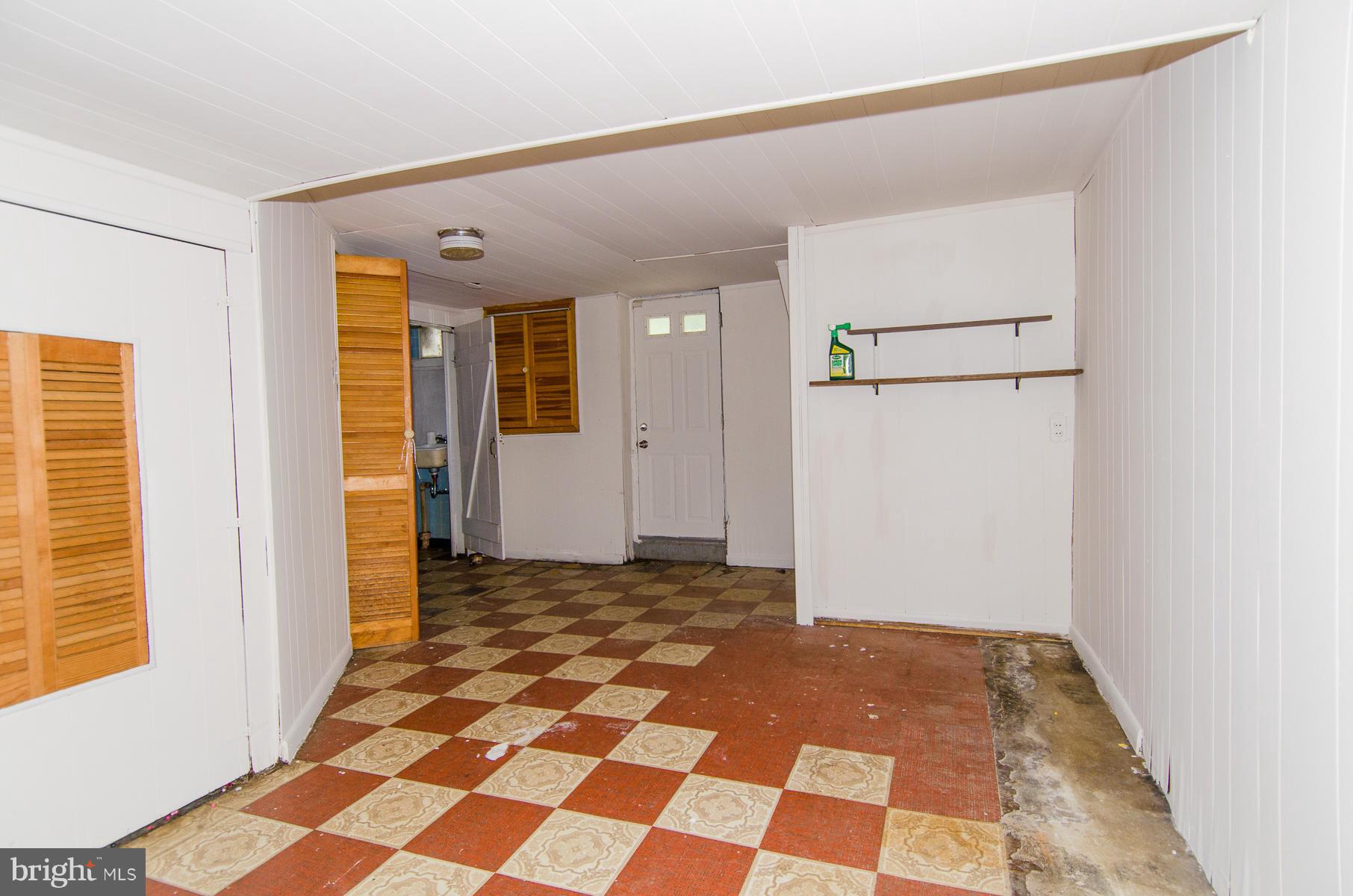 1417 Stonewood Road Baltimore, MD 21239 - Photo 20 of 28 a view of a closet area with living room